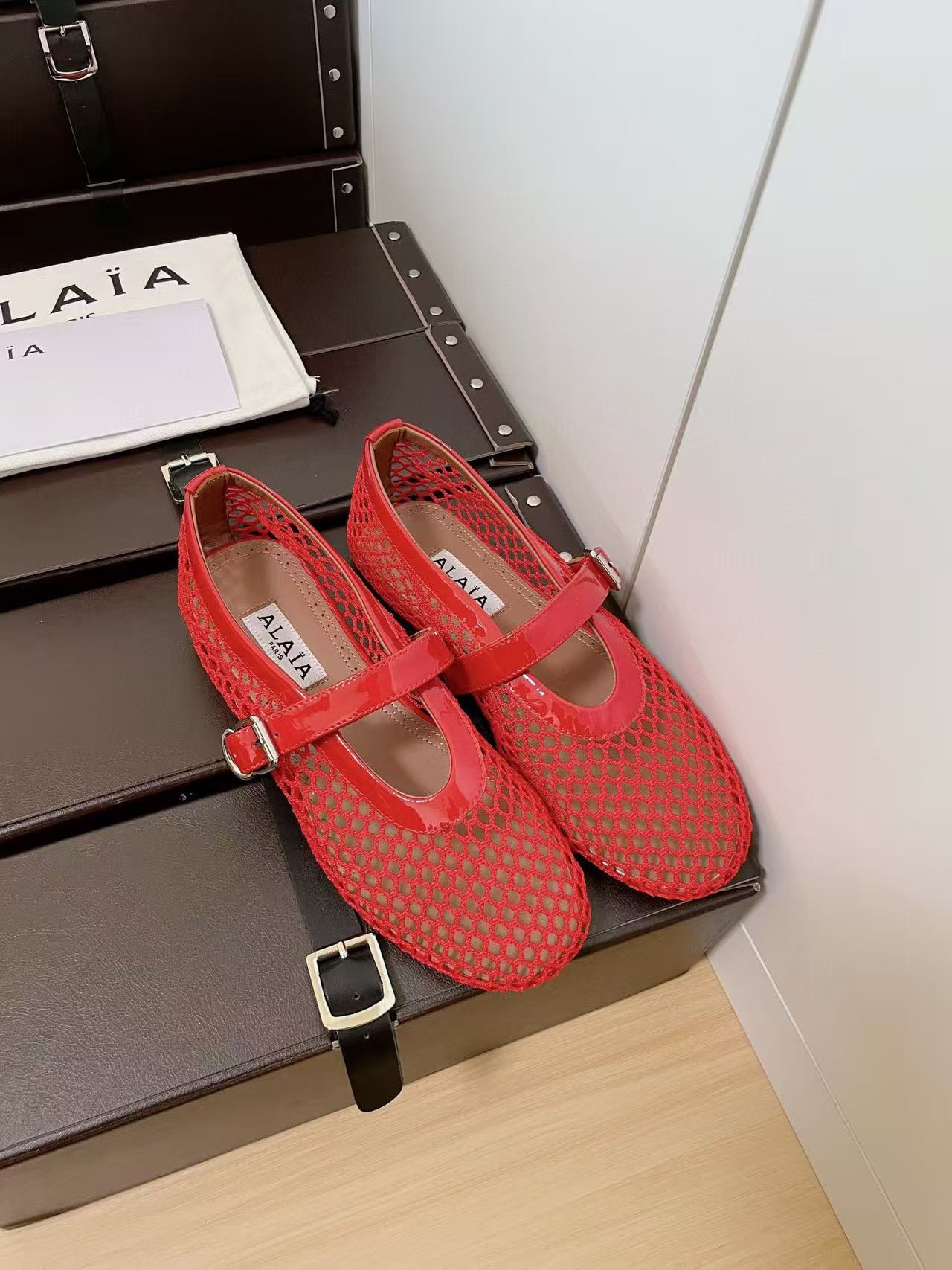 UA ALAÏA BALLET FLATS IN FISHNET