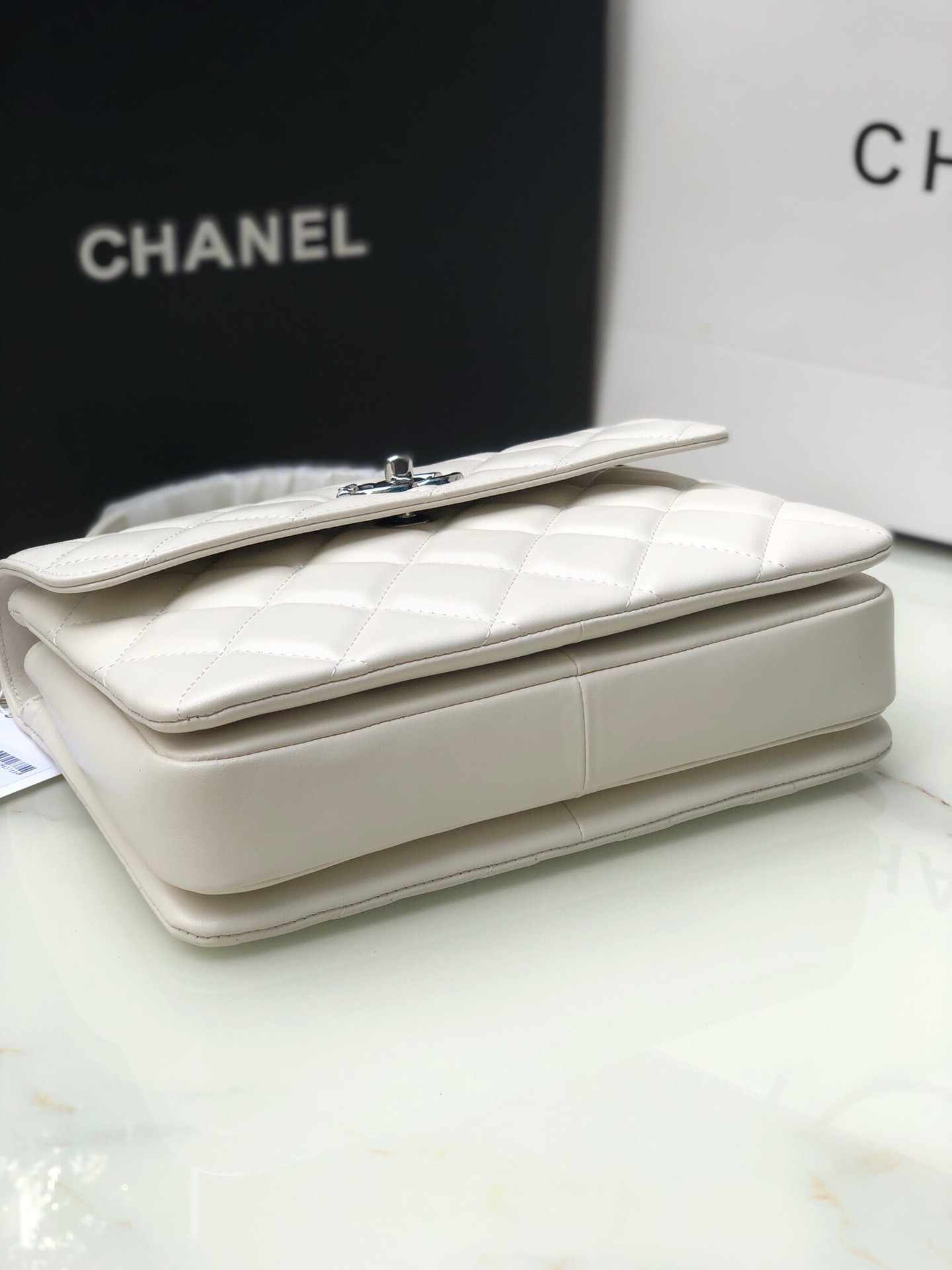 Ch*el flap bag with top handle 6.6 × 9.8 × 4.7 in