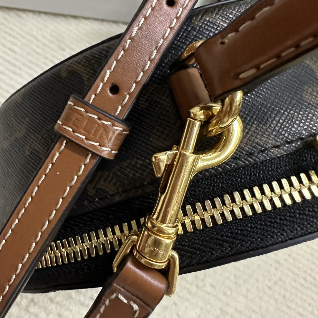 Ce**e half moon case in triomphe canvas and calfskin 17.5x12x6cm